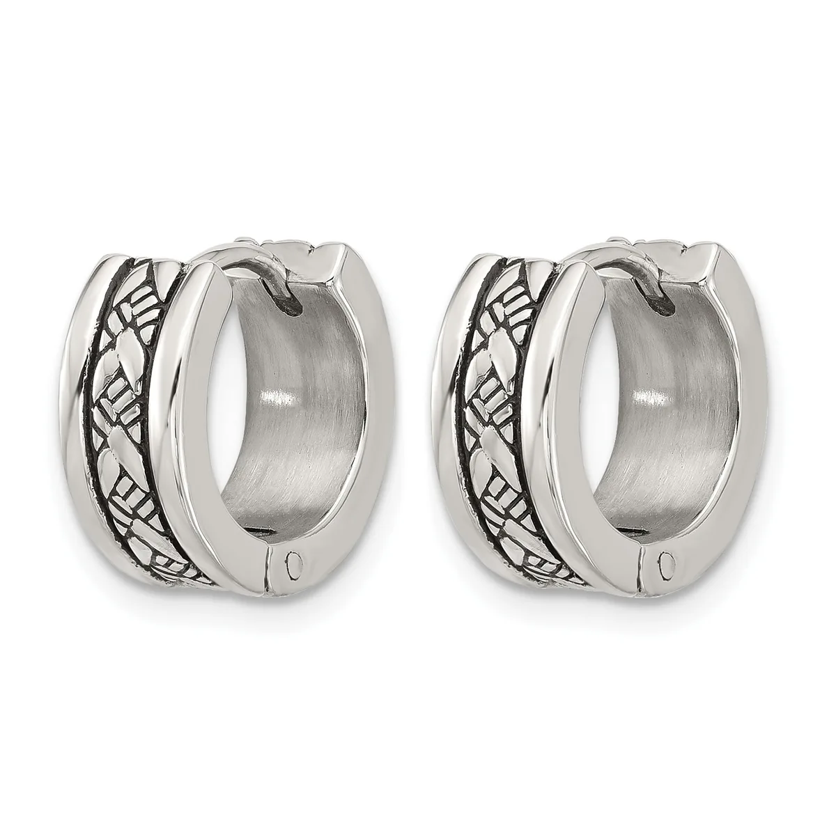 A pair of polished silver huggie hoop earrings with an oxidized geometric leaf or wing pattern along the sides, shown from the front against a white background.