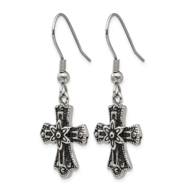 A pair of ornate silver-tone cross earrings with decorative scrollwork and a star center, suspended from fish hook wires with beaded accent beads.