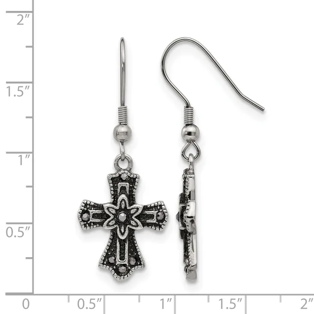 A pair of ornate silver-toned cross earrings with decorative scrollwork and beaded details, shown front and back view next to a ruler indicating approximately one inch in length.