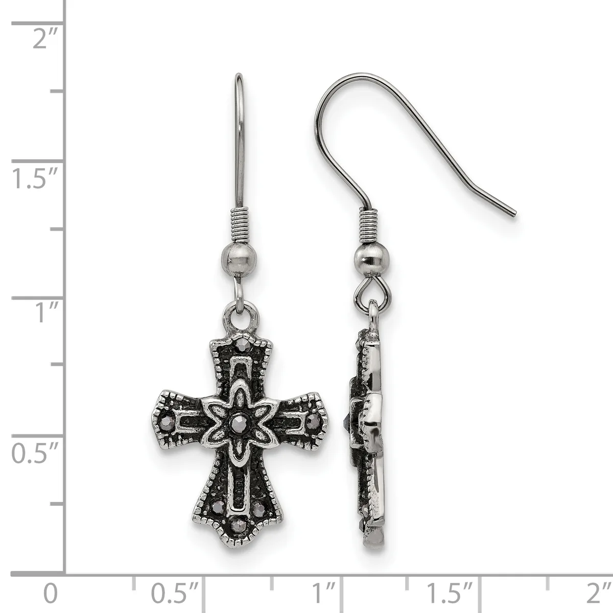A pair of ornate silver-toned cross earrings with decorative scrollwork and beaded details, shown front and back view next to a ruler indicating approximately one inch in length.