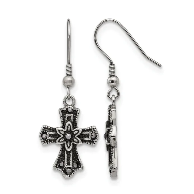 A pair of ornate silver-toned cross earrings with decorative beaded borders and floral center designs, shown from front and side views on fish hook wires.