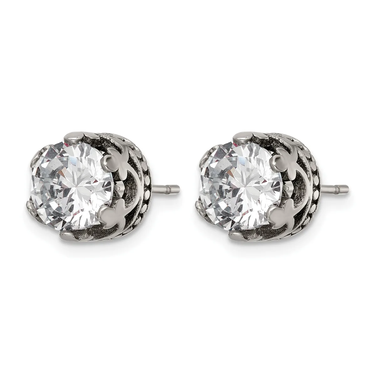 A pair of silver stud earrings with round clear cubic zirconia stones set in ornate filigree settings with small posts.