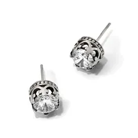 A pair of silver stud earrings with ornate filigree settings holding round brilliant-cut clear gemstones, displayed against a white background.