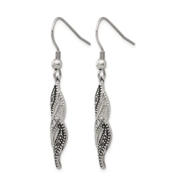 A pair of silver-toned fish-shaped dangle earrings with pave crystal embellishments, suspended from hook-style ear wires.