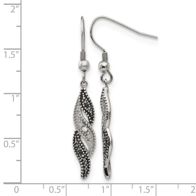 A pair of silver-tone dangle earrings with twisted leaf-shaped pendants decorated with black and clear crystals, displayed against a ruler showing they measure approximately 1.5 inches long.