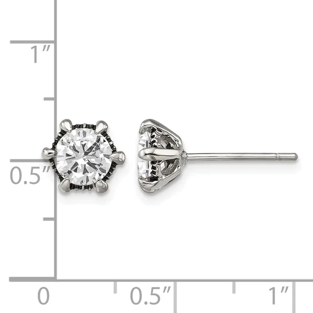A pair of silver stud earrings with round clear gemstones set in ornate prong settings, shown front and back view with a measurement scale.