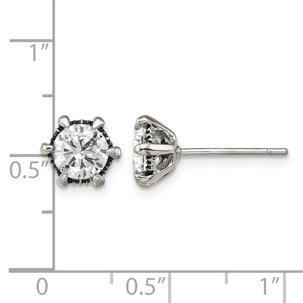A pair of silver stud earrings with round clear gemstones set in ornate prong settings, shown front and back view with a measurement scale.