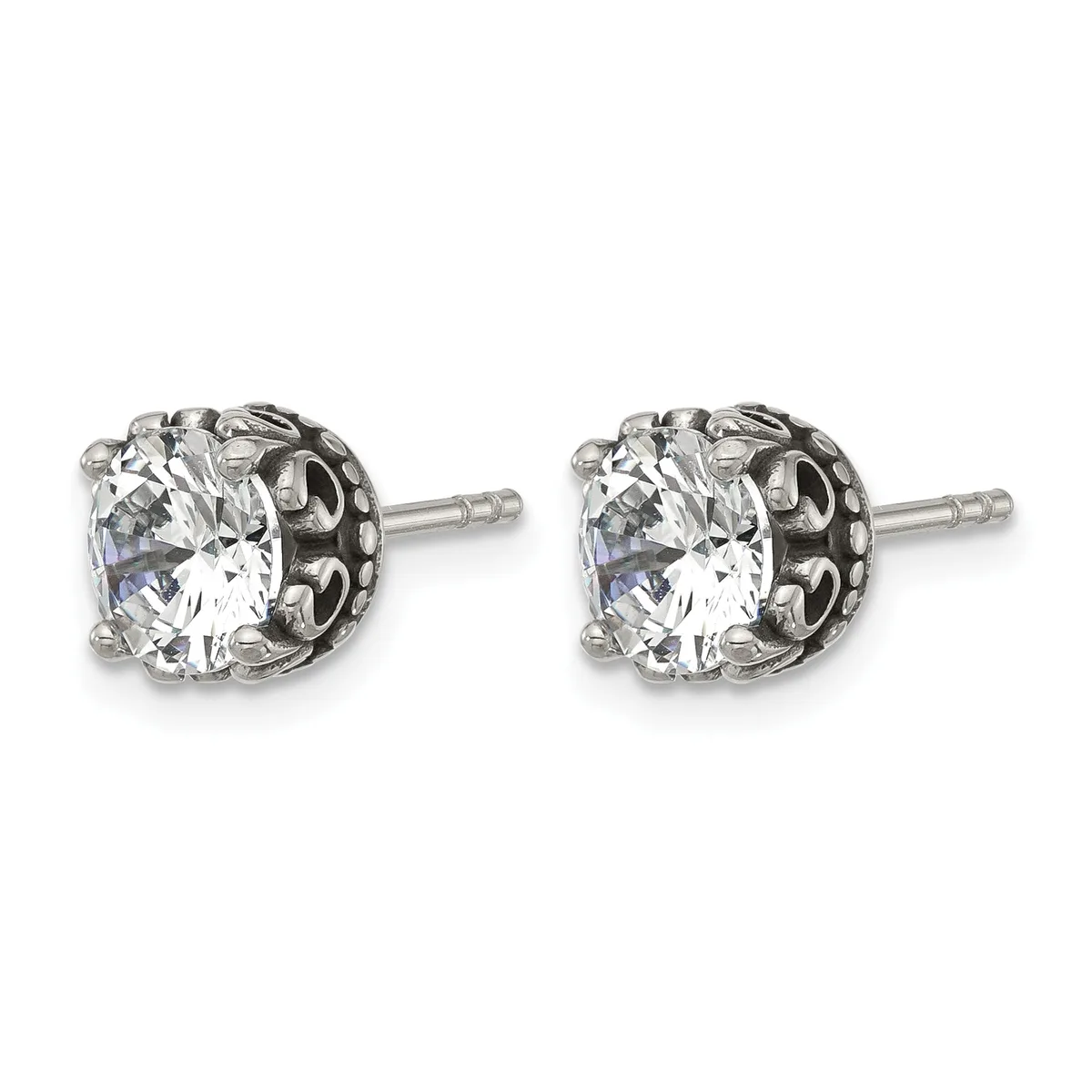 Pair of silver stud earrings with round clear cubic zirconia stones set in ornate filigree settings with posts and backs.