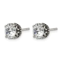 Pair of silver stud earrings with round clear cubic zirconia stones set in ornate filigree settings with posts and backs.