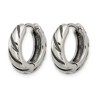 A pair of silver hoop earrings with twisted diagonal black striping and textured surfaces, shown from the front.