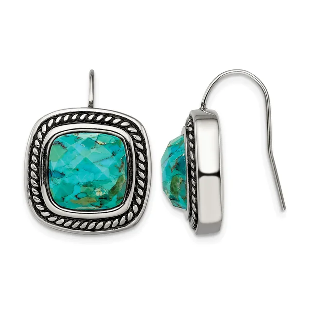 Pair of silver earrings with twisted rope borders surrounding cushion-shaped turquoise stones, shown from front and side views.