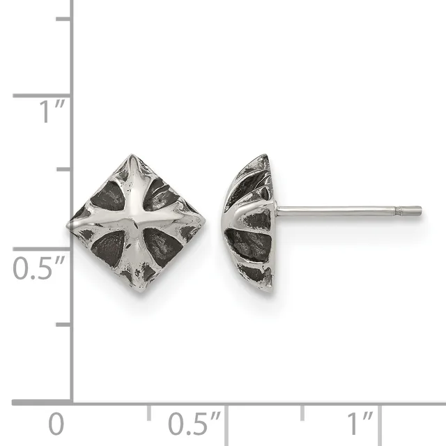 A pair of silver stud earrings with a square diamond shape featuring a cross pattern and dark oxidized sections, shown front and side view against a measurement scale.
