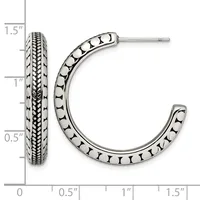 A pair of silver hoop earrings with decorative beaded and textured patterns, displayed next to a measurement ruler showing they are approximately 1.5 inches long.