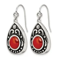 Pair of silver teardrop earrings with ornate black enamel scrollwork, red oval cabochon stones, small rhinestones, and matching fish hook wires with round crystal tops.