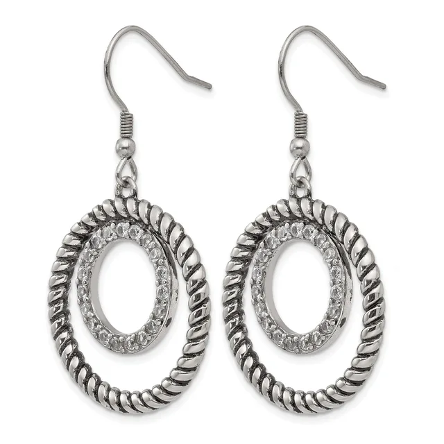 Pair of silver-toned dangle earrings with twisted oval frames surrounding textured oval centers, suspended from fish hook ear wires.