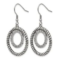 Pair of silver-toned dangle earrings with twisted oval frames surrounding textured oval centers, suspended from fish hook ear wires.