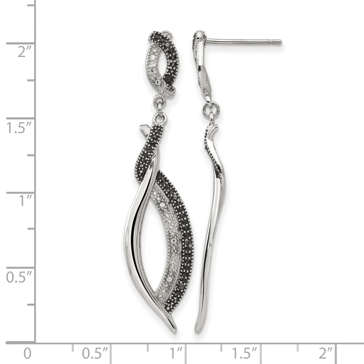 Pair of silver drop earrings with black and clear crystals arranged in curved leaf shapes, shown against a measurement scale.