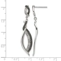 Pair of silver drop earrings with black and clear crystals arranged in curved leaf shapes, shown against a measurement scale.