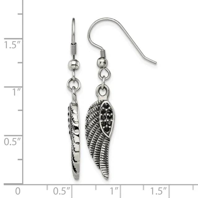 A pair of silver-toned dangle earrings featuring textured wing charms suspended from fish hook wires, displayed against a measurement scale showing approximately 1.5 inches in length.