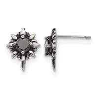 Pair of stud earrings featuring black round gemstones surrounded by spiked metal petals in oxidized silver, shown from front and side views.