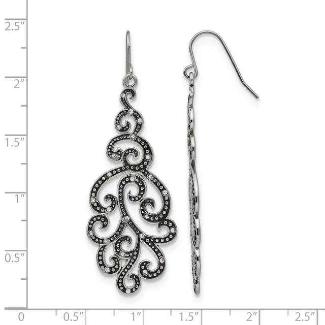 Pair of ornate silver-tone filigree earrings with scrollwork design and small crystal accents, shown front and back views against a ruler measuring approximately two inches in length.