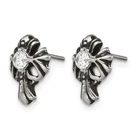 Pair of stainless steel bow-shaped stud earrings with round clear cubic zirconia centers and small hallmarks on the posts.