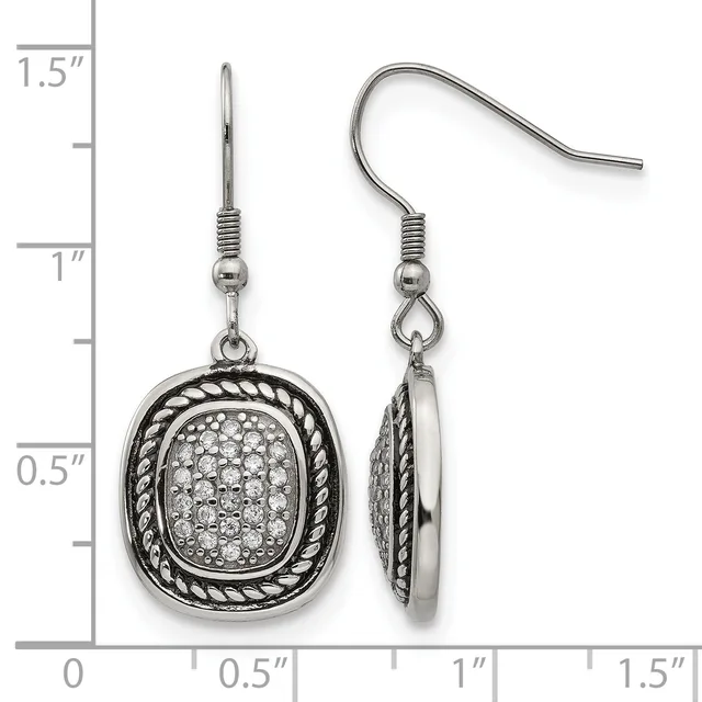 Pair of silver-toned dangle earrings with twisted rope-textured oval frames enclosing crystal-paved centers, shown on a measurement scale.