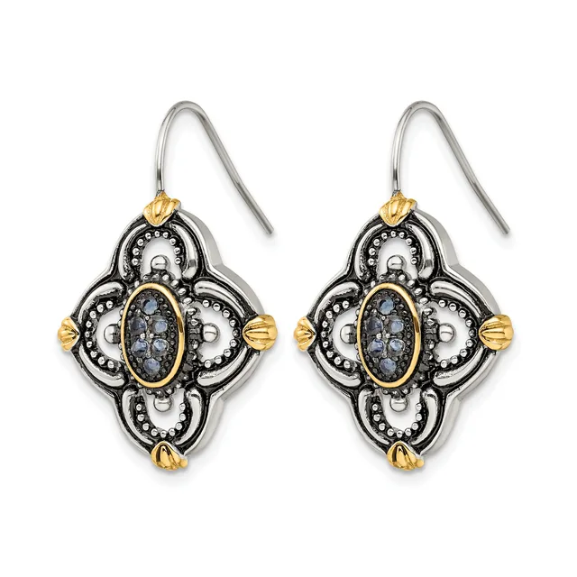 Pair of ornate quatrefoil drop earrings with blue stone centers, silver oxidized finish with gold-tone accents and beaded details, hanging from silver ear wires.