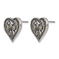 Pair of silver heart-shaped stud earrings with ornate filigree design and beaded borders, shown from the front.