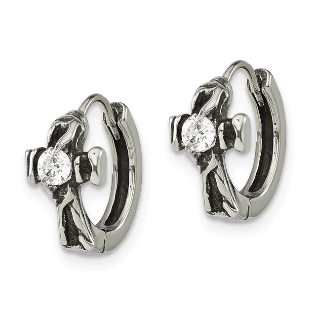 A pair of silver hoop earrings with diamond solitaires set in decorative metalwork, shown from the front against a white background.