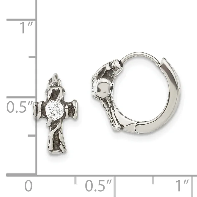 A pair of silver cross-shaped hoop earrings with round white stones displayed next to a measurement scale showing approximately 0.5 inches in length.
