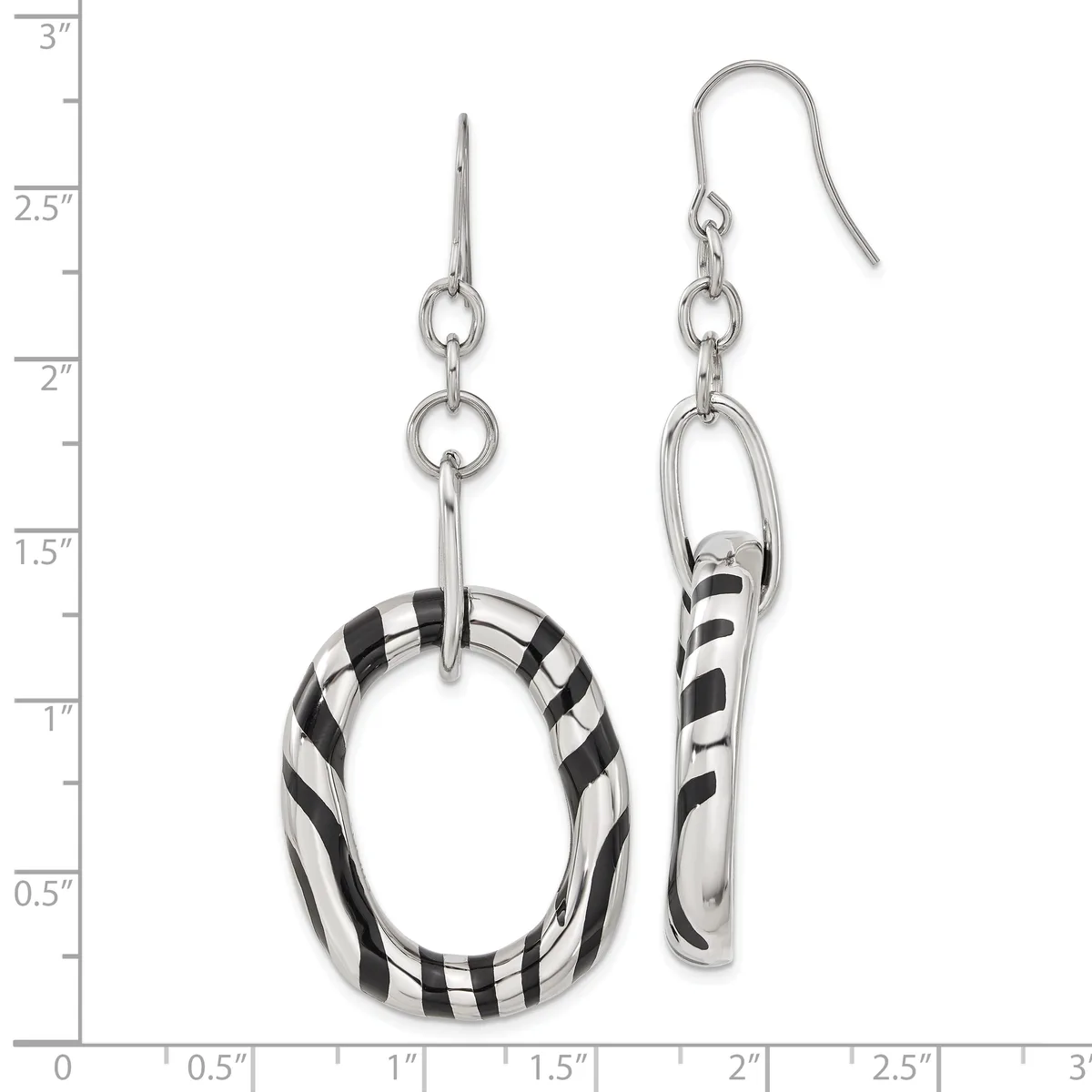 A pair of silver dangle earrings with black and white striped resin components, displayed against a measurement scale showing they are approximately three inches long.
