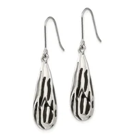 A pair of silver teardrop earrings with black striped pattern details, suspended from curved wire hooks.