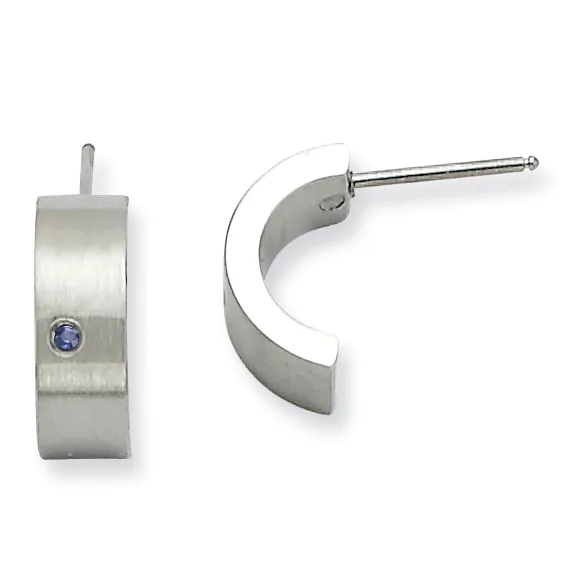 A pair of stainless steel hoop earrings with a brushed finish and small blue stone accent, shown from front and side views.