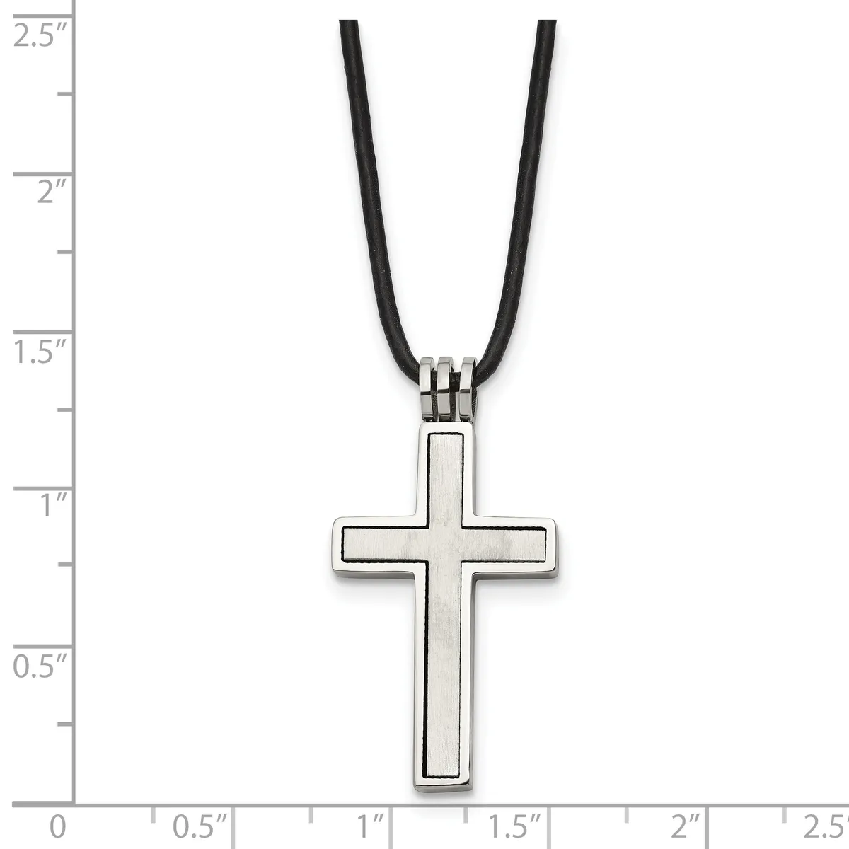 A silver cross pendant with an outlined rectangular design hanging from a black cord, shown against a ruler measuring approximately 1.25 inches in height.