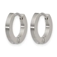A pair of polished silver-tone hinged hoop earrings with a brushed matte finish on the outer surface and a small hallmark on each closure.