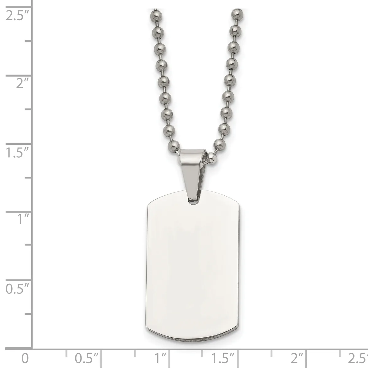 A stainless steel dog tag pendant with rounded corners hangs from a ball chain, shown against a measurement scale indicating the tag is approximately 1.5 inches tall.