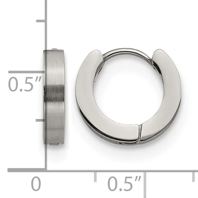 A pair of polished stainless steel chunky hoop earrings shown next to a ruler indicating they are approximately 0.5 inches in diameter and width.