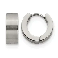 A pair of polished silver huggie hoop earrings shown from the front and side, displaying their chunky cylindrical design and hinged closure.