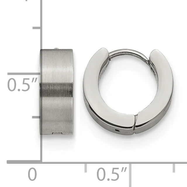 A pair of chunky stainless steel huggie hoop earrings shown from front and side views with measurement scale indicating 0.5 inch width.