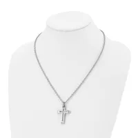 A silver-toned cross pendant hangs from a delicate chain necklace displayed on a white mannequin bust.