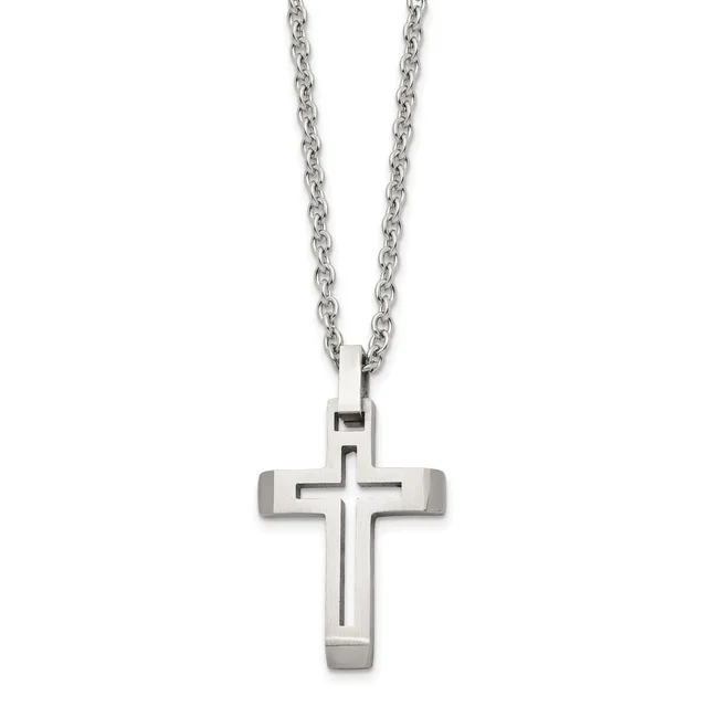 A stainless steel cross pendant with cutout details hangs from a matching chain against a white background.