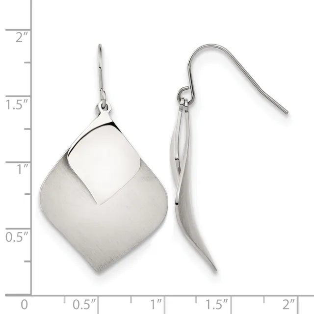 Pair of silver dangle earrings with curved geometric forms and fish hook closures, shown next to a ruler measuring approximately two inches in length.