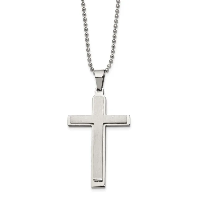 A polished stainless steel cross pendant hanging from a ball chain necklace against a white background.