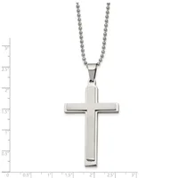 A polished silver cross pendant hangs from a beaded silver chain, displayed against a measurement scale showing the pendant is approximately 1.5 inches tall.