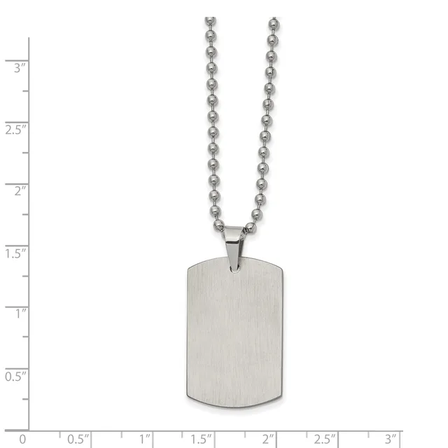 A stainless steel dog tag pendant with rounded corners hangs from a ball chain, displayed against a measurement scale showing approximately 3 inches in total length.