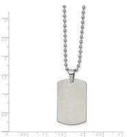 A stainless steel dog tag pendant with rounded corners hangs from a ball chain, displayed against a measurement scale showing approximately 3 inches in total length.
