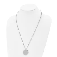 A silver-tone chain necklace with a round disc pendant displayed on a white mannequin bust.