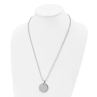 Silver-toned necklace with a thin chain and small circular pendant displayed on a white mannequin bust.