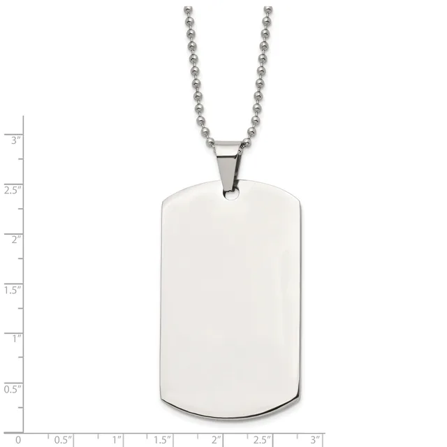 A stainless steel dog tag pendant with rounded corners hangs from a ball chain, shown against a measurement scale indicating its size is approximately 2.5 inches tall and 1.5 inches wide.